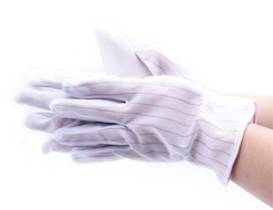 Anti-static plastic gloves with particles